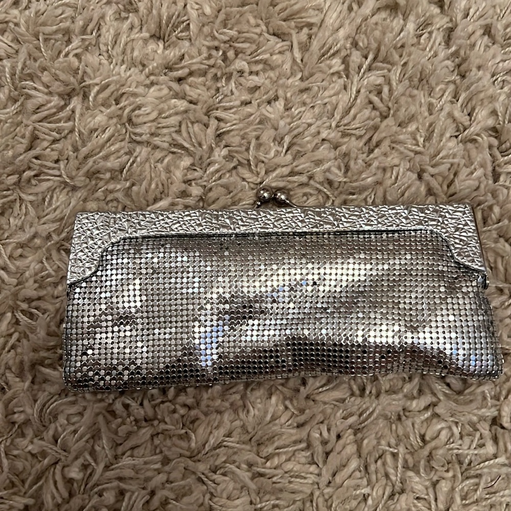 Silver Cache clutch with chain.